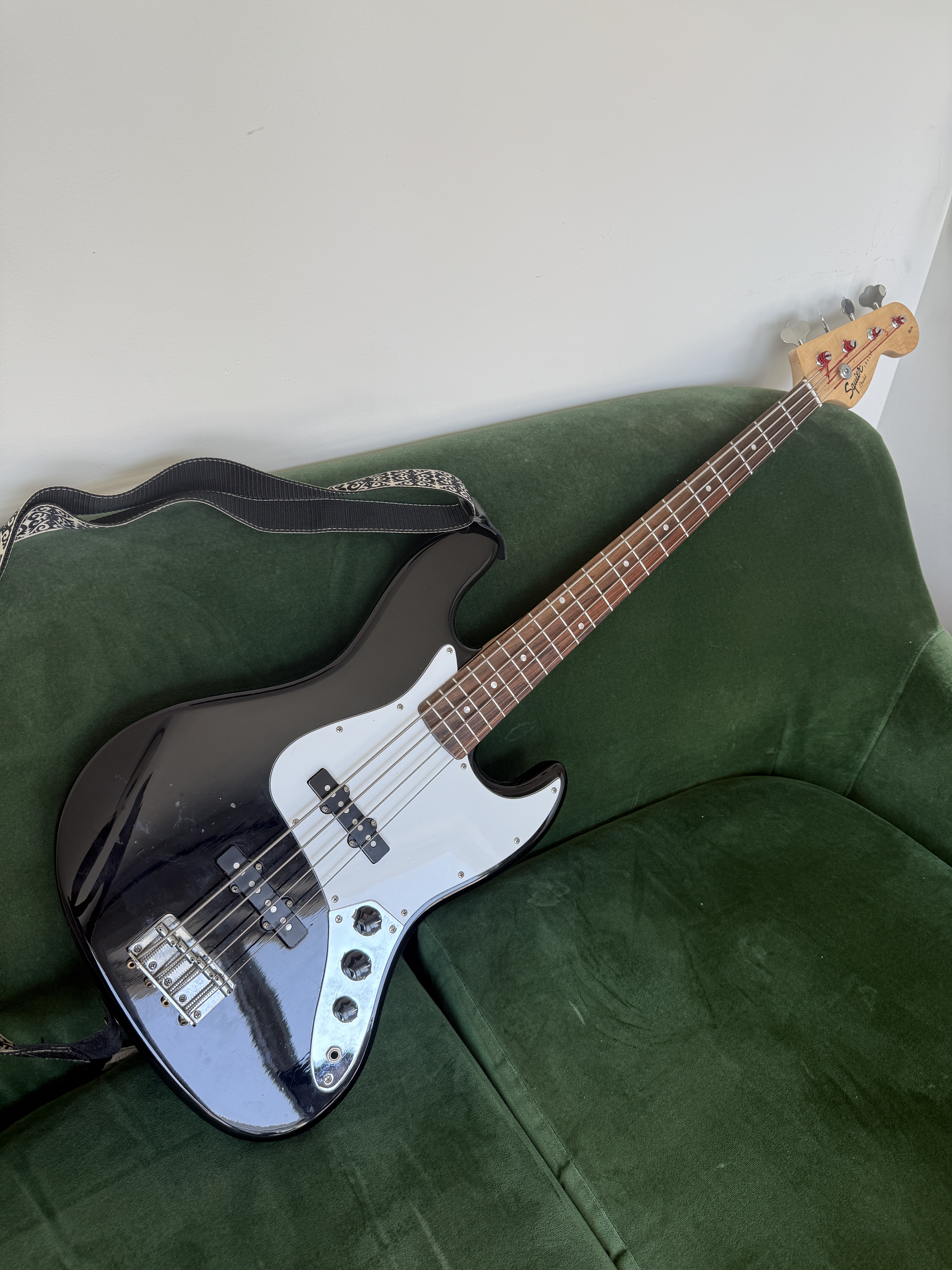 Fender Jazz Bass guitar with padded gig bag and strap